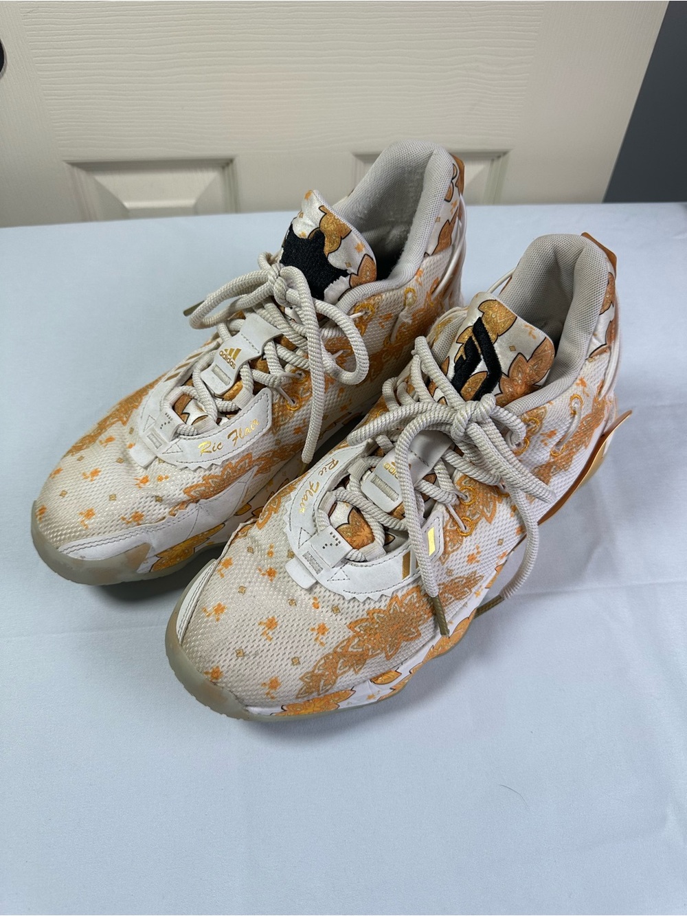 adidas men’s Ric Flare White and Gold Patterned Sneakers